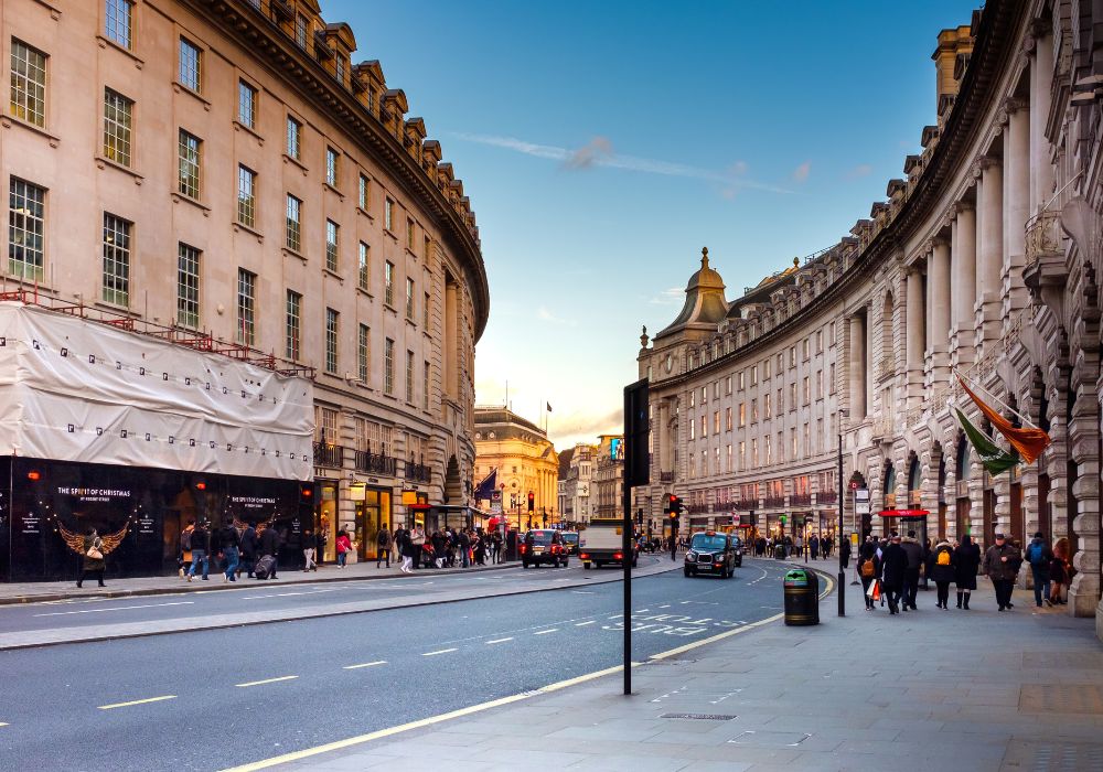 Photo of people walking in the street of London