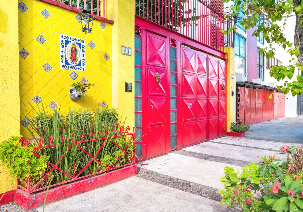 Colorful walls and gates in the historic Coyocan neighborhood of Mexico City.