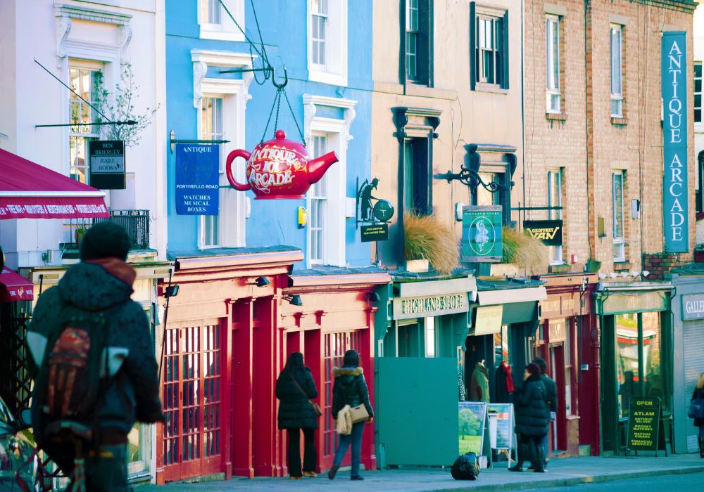 colourful streets with buildings and people in notting hill neighbourhood london