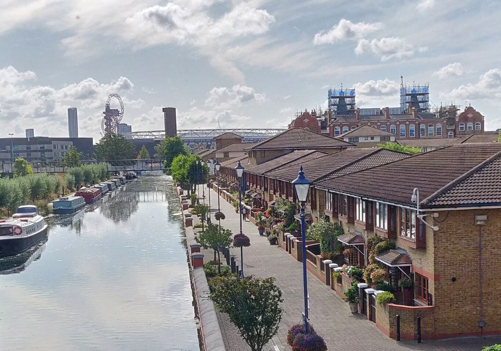 A partly cloudy sky in Stratford, London along the canal.