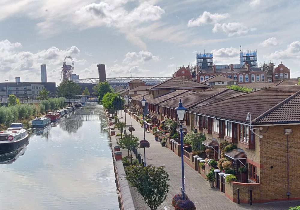 A partly cloudy sky in Stratford, London along the canal.