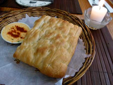 freshly made bread with herb cheese spread at Cafe By The Ruins