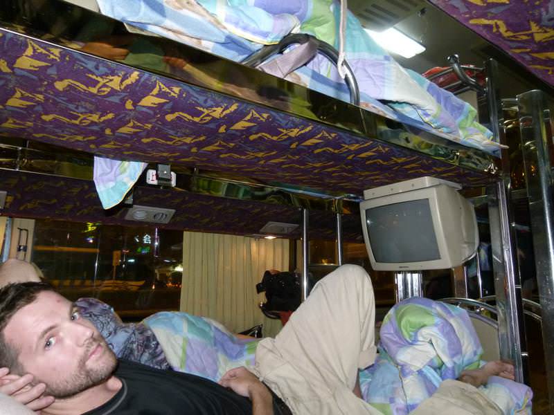 Nick getting comfortable on the overnight bus to Yangshuo Nick getting comfortable on the overnight bus to Yangshuo