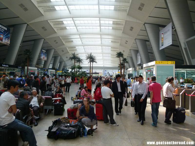 Dariece waiting for the train to Shanghai in the Beijing train station Budget Backpacking Couple In Shanghai