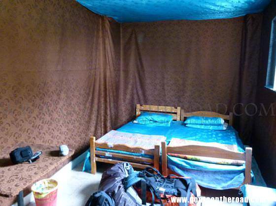 This is the kind of room you can end up with if you don't ask to see a few different ones! This room had fabric glued to everything in the room and it had a sewage pipe under the bed! budget backpacking tips