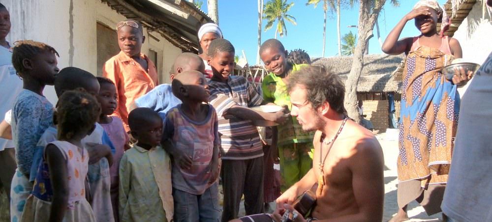 Backpacking Mozambique Our Friend Henrik, Playing The Ukilelee For Villagers On Quirimbas Island
