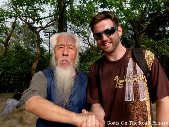 people of china travel china teach goats on the road