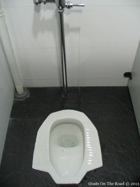 Backpackers use A Squat Toilet