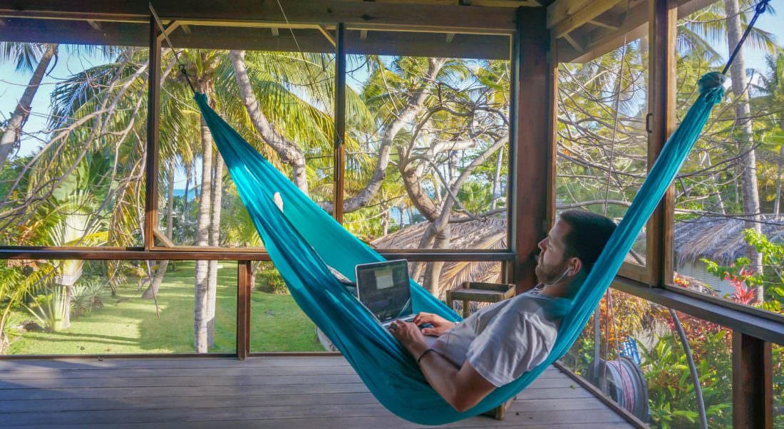 me working on my computer in a hammock being productive