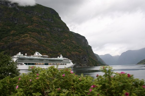 cruise ship at port making money for travel from cruise ship work