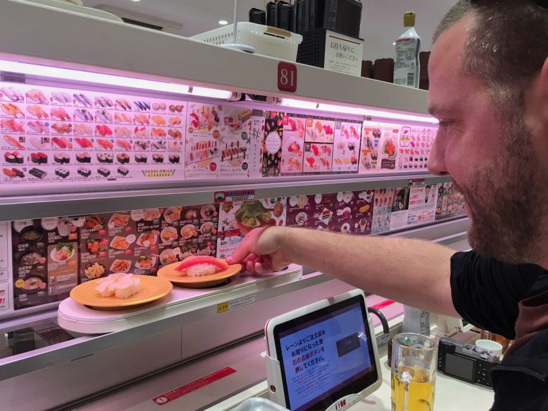 what to do in tokyo japan eat at a conveyor belt sushi restaurant