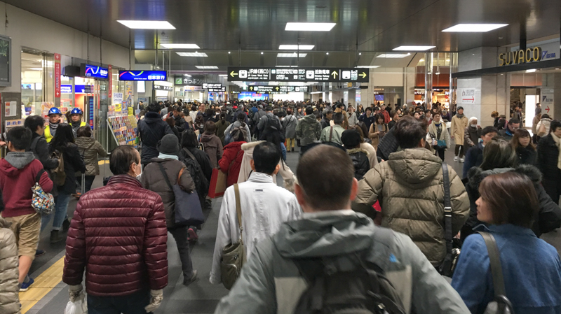 getting around by train in kyoto the train station is busy