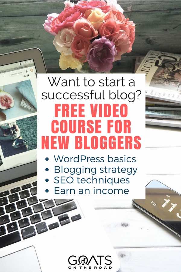 Laptop, flowers and phone on desk with text overlay free course for new bloggers