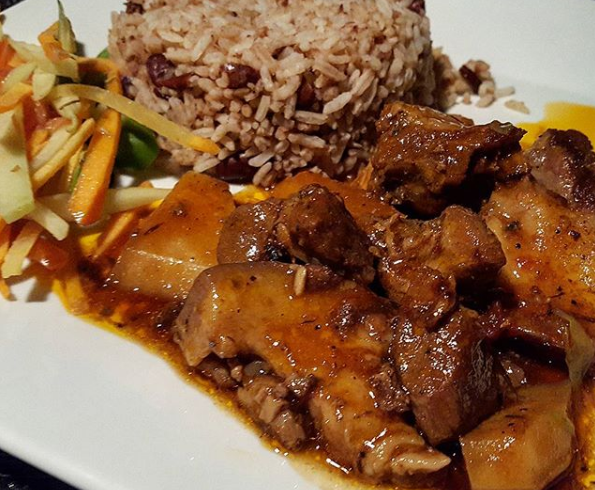 must try jamaican cuisine of Jamaican Stew Pork with Rice and Peas