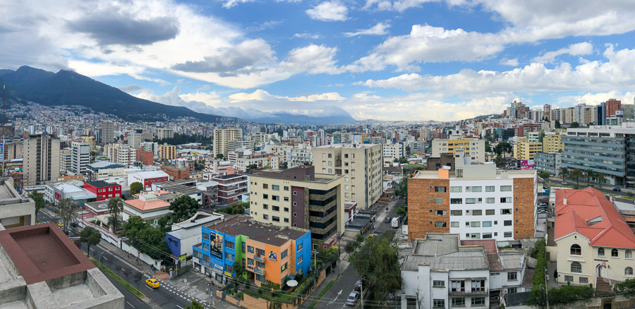 overlooking the new town in quito. buildings and mountains