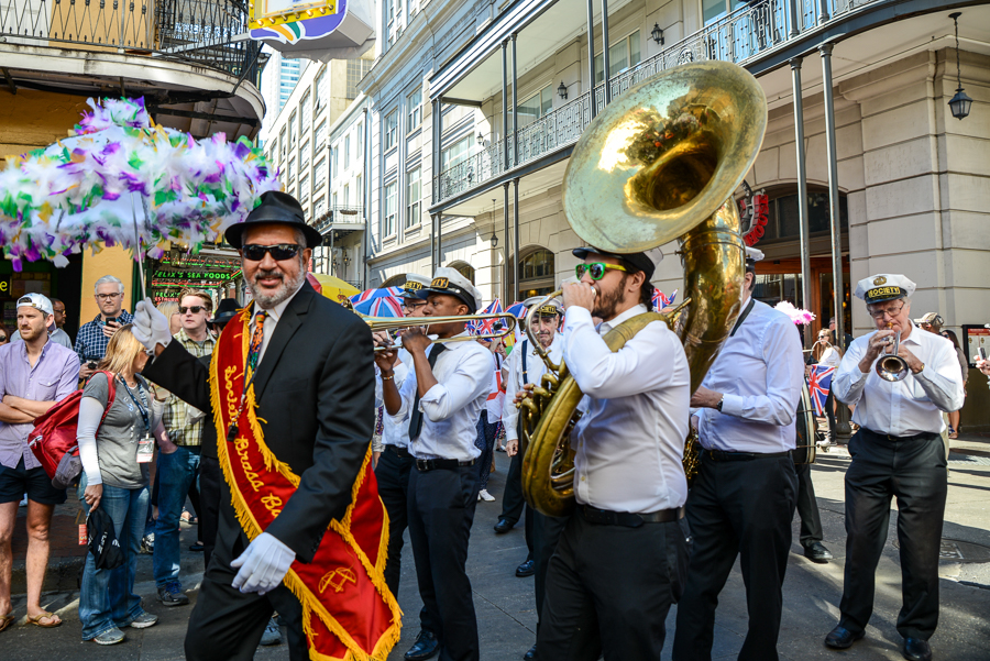 Musicians marching on the street during the French Quarter Festival, one of the best New Orleans music festivals