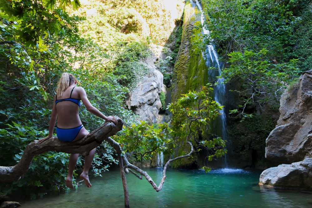 Taking a swim in a pool below a waterfall in the Gorge of Richtis, Crete