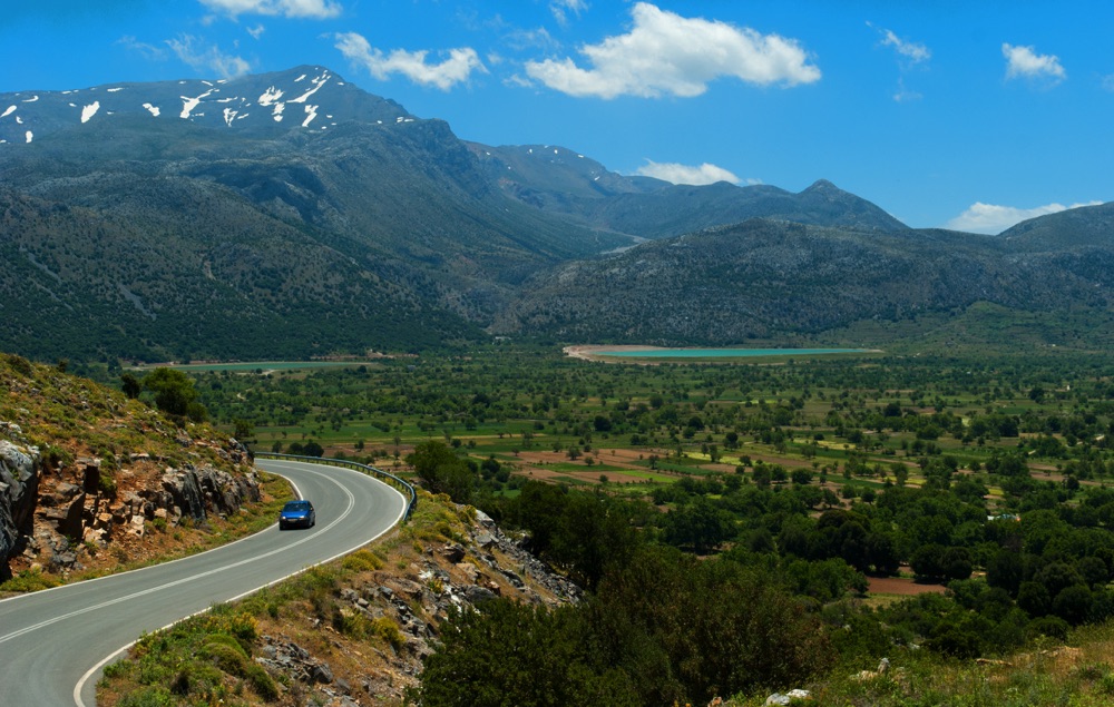 Road winding through the farms and mountains of the Lasithi Plateau, Crete