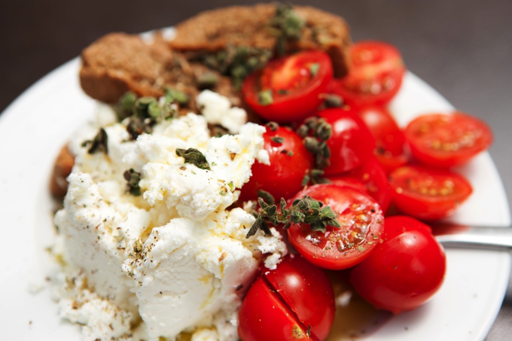 Traditional Crete food often includes cheese, tomatoes and bread.