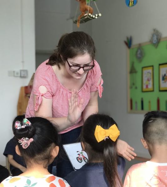 girl teaching students in china