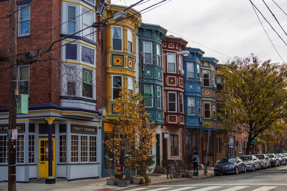 A row of colorful townhouses, a possibility for where to stay with a weekend in Philadelphia