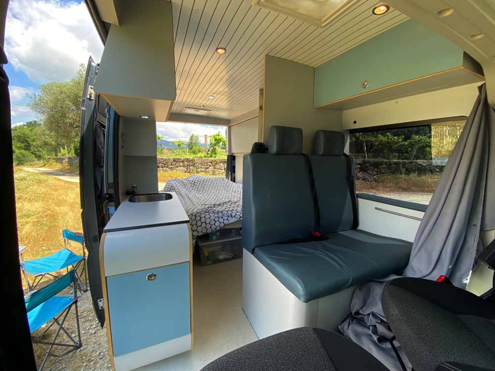 Inside van view. The front seats swivel backwards when you're not driving to give more seating and open up the inside area more