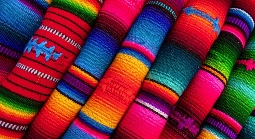 Colorful fabric at a market in La Paz. One of the best things to do in La Paz is to visit a market.