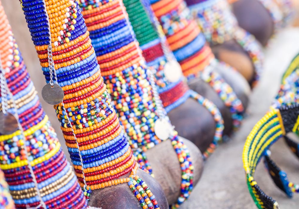 Maasai rungu decorated with beads in different colors and sold as a souvenir at a local Maasai Market.