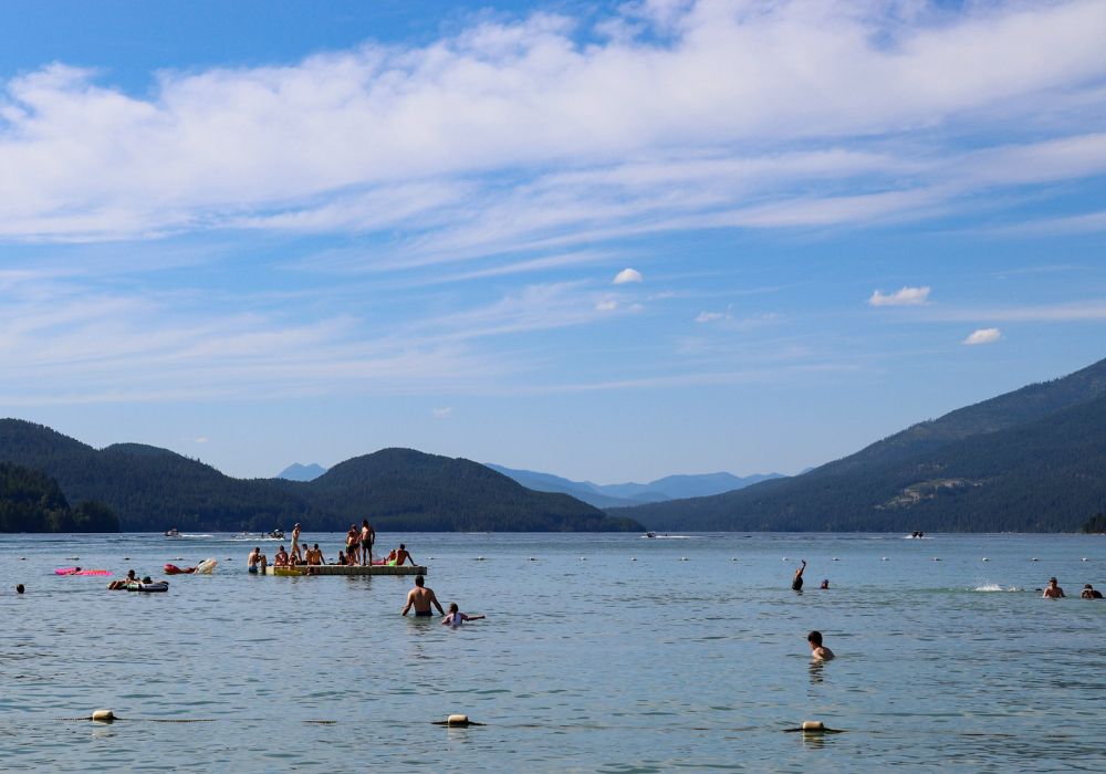 People are swimming in Whitefish Lake.