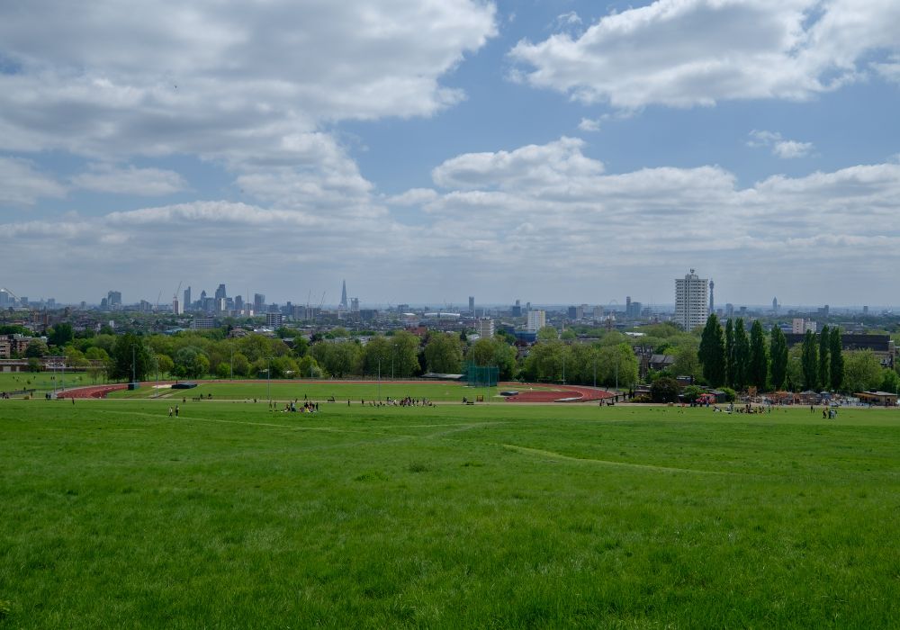 Green and clean park of Hampstead Heath in London during the morning.