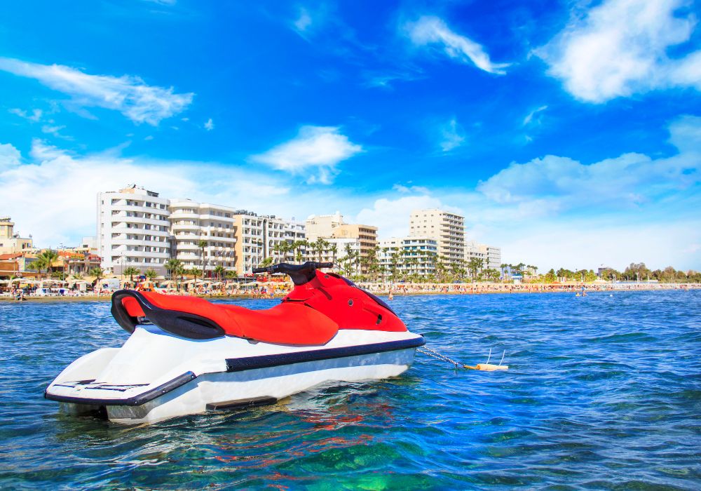 15 Most Lovely Seashores in Cyprus 14 The beautiful Finikoudes beach with some architecture in the area under a clear blue sky.