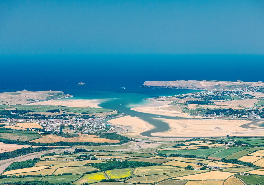 Aerial views towards the coast at Rock and Padstow, Cornwall on a bright sunny day.