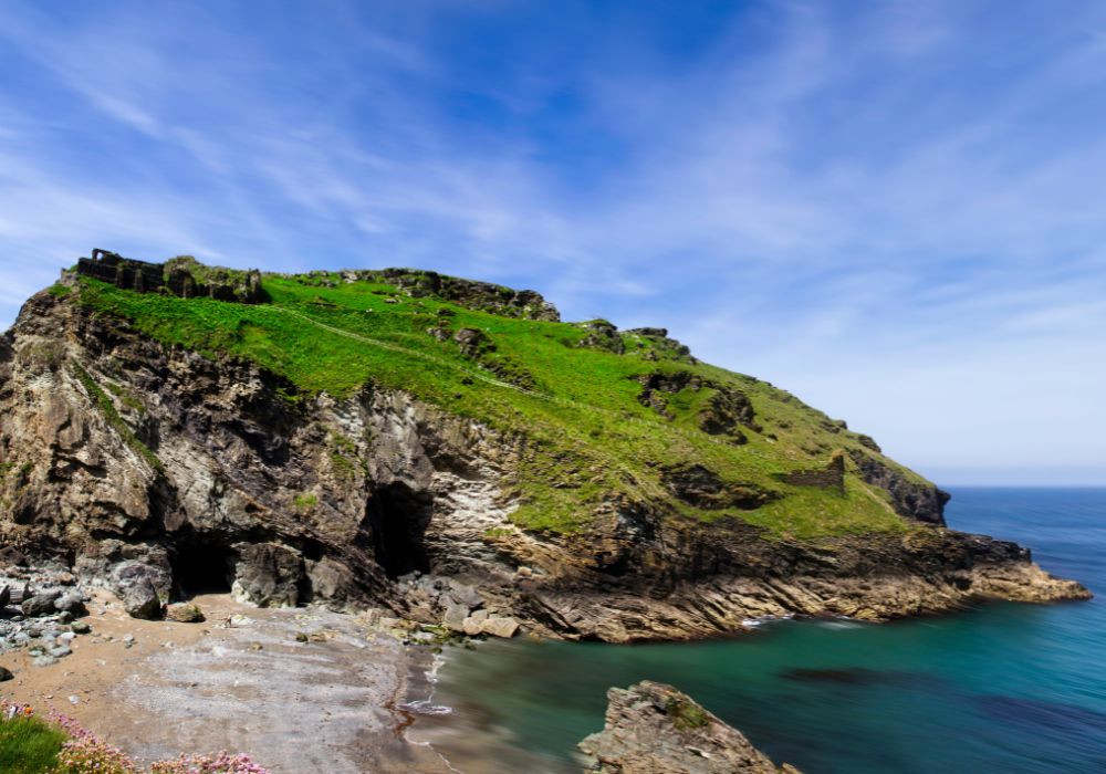 The stunning Merlin's Cave on a bright and sunny day in Tintagel, Cornwall.