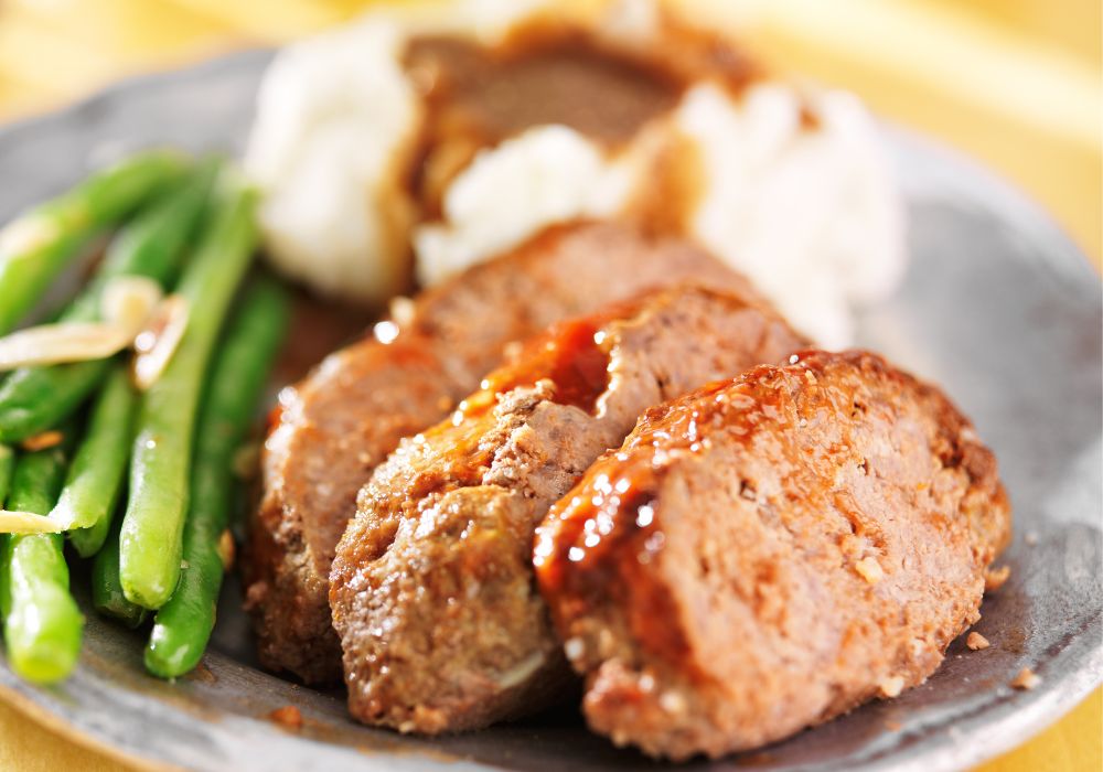 Meatloaf with greenbeans and mashed potatoes.