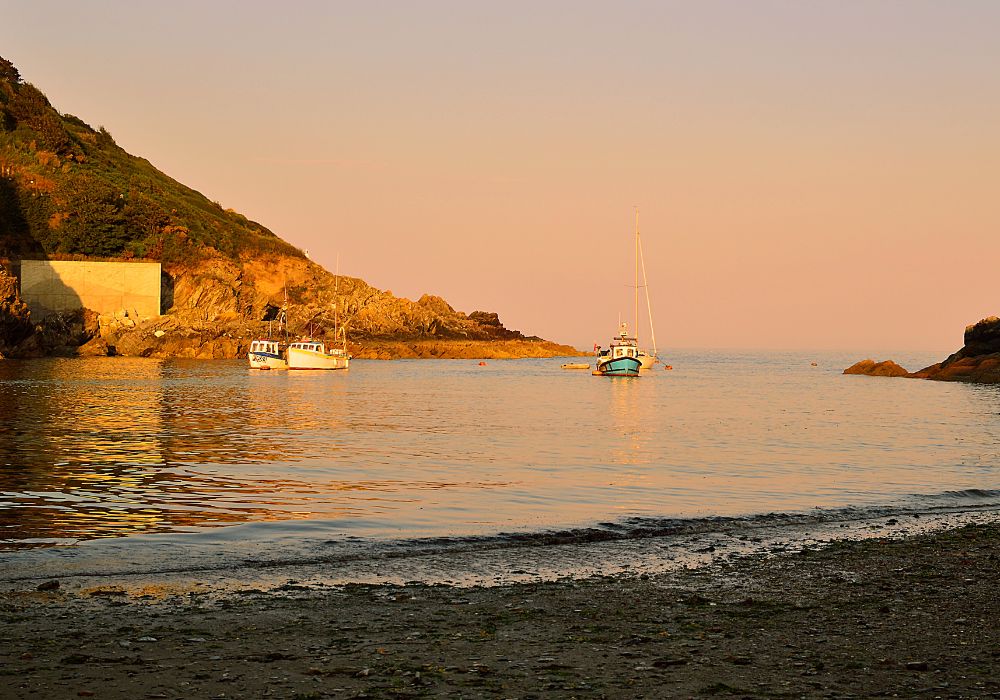 Polperro harbour at sunset.