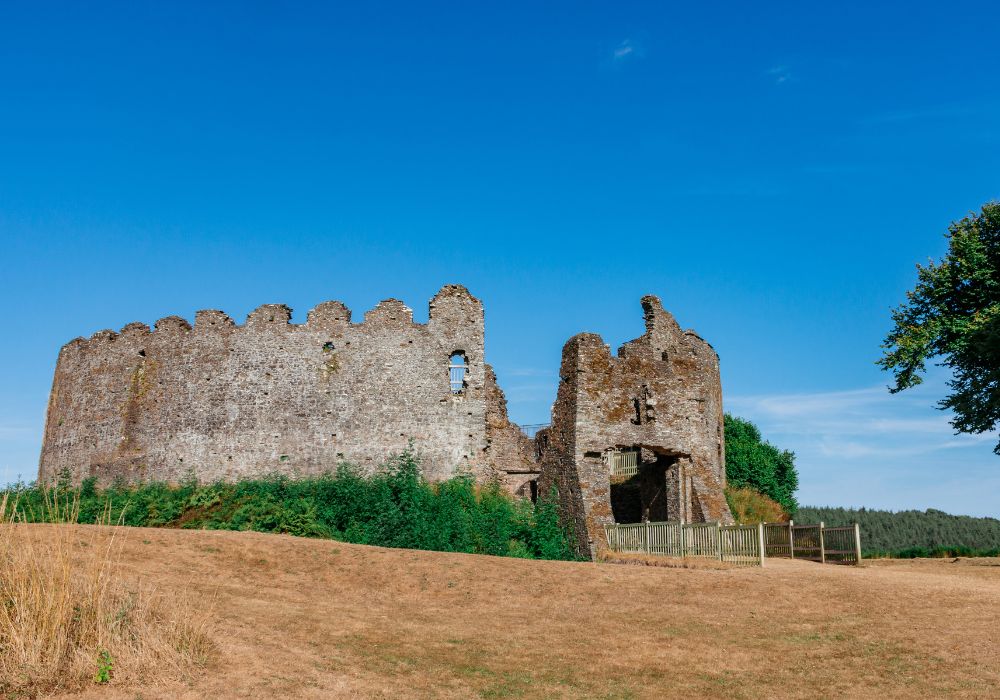 Ruins at Restormel Castle near Lostwithiel in a clear blue sky.