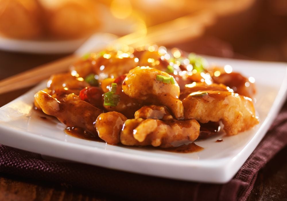 Tasty chinese food on a white ceramic plate