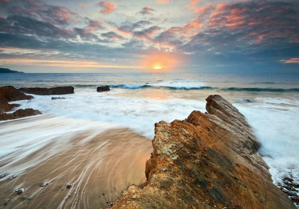 Rock formations on the beach in Widemouth Bay, Cornwall.