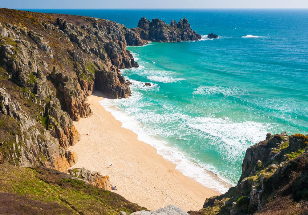 The overlooking Pedn Vounder beach from Treen Cliffs in Cornwall, England.