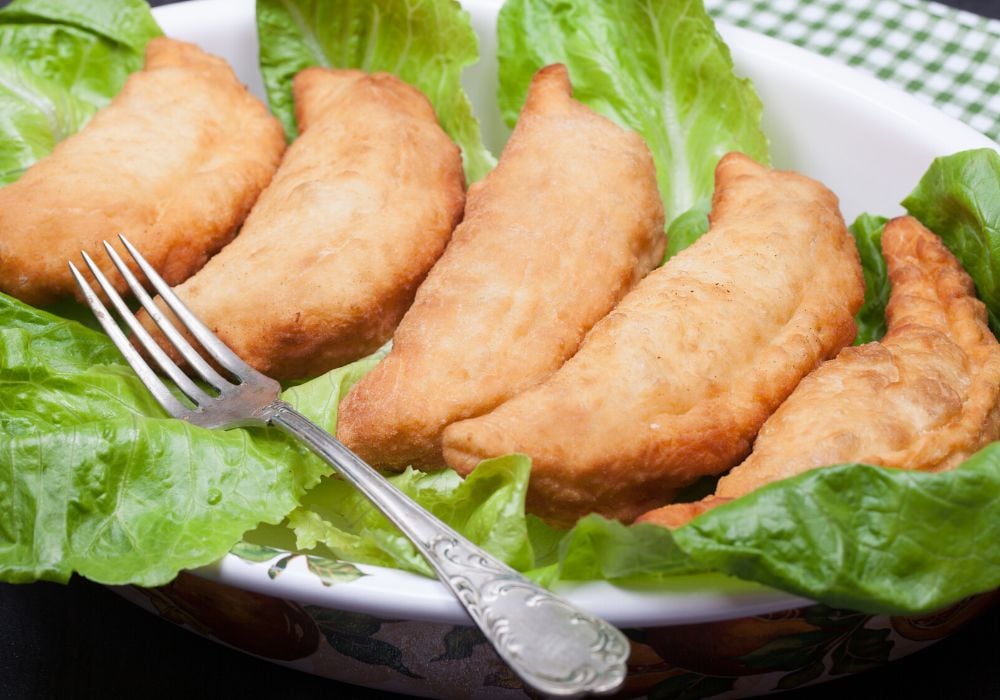 A Panzerotti filled with cheese, salami and stew leek.