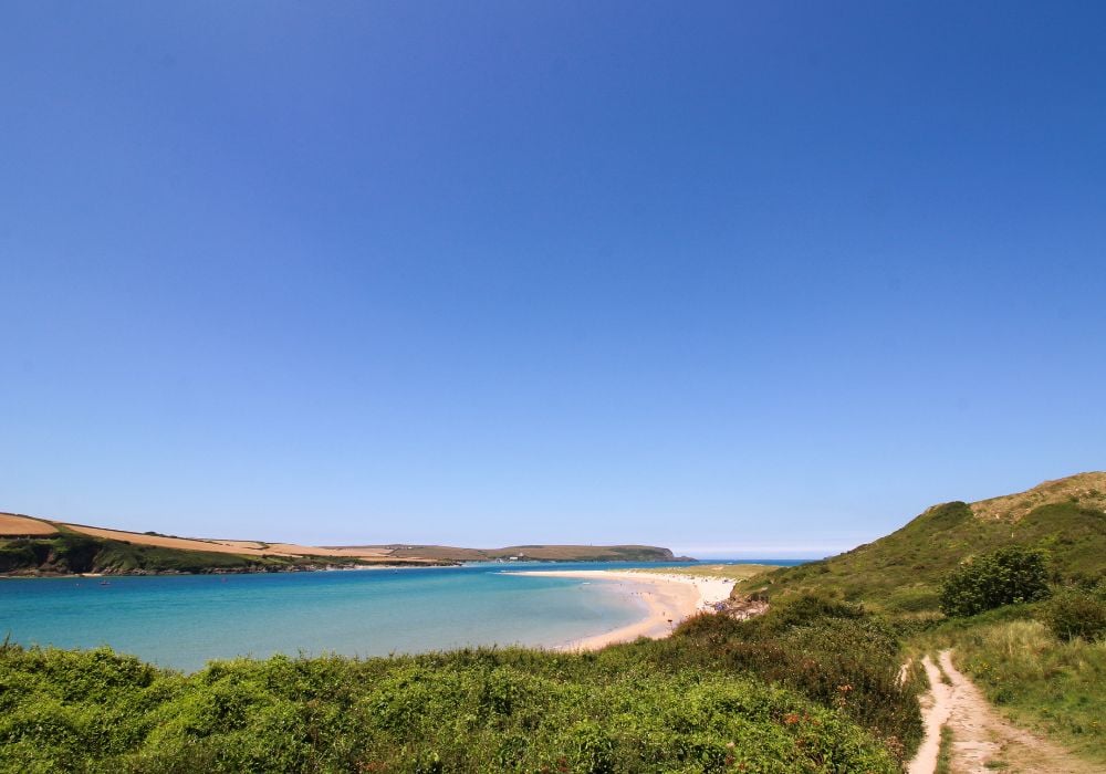 Beautiful sunny day overlooking the Trevone Bay on a rock village beach in Cornwall, England.