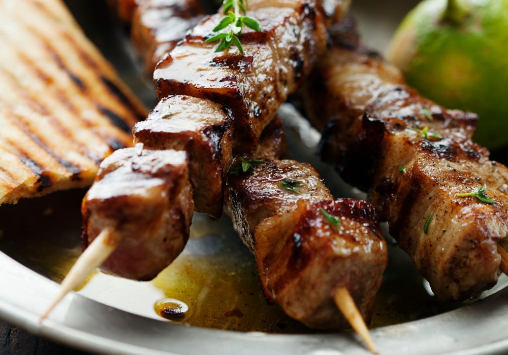 A delicious Souvlaki with herbs, lime and pita bread.