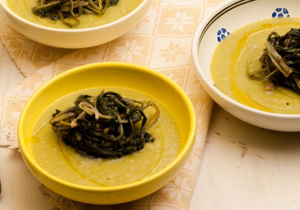 Fave e cicoria is a traditional dish from Puglia served on ceramic bowl