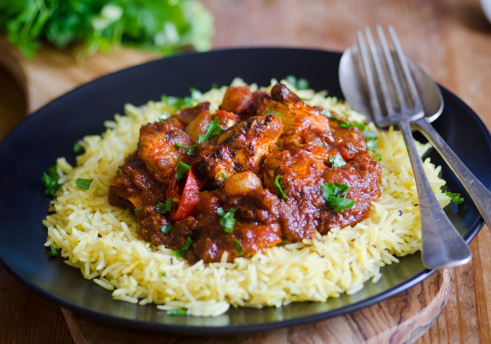 A hot and sour curry with char-grilles chicken, tomatoes and red chillies
