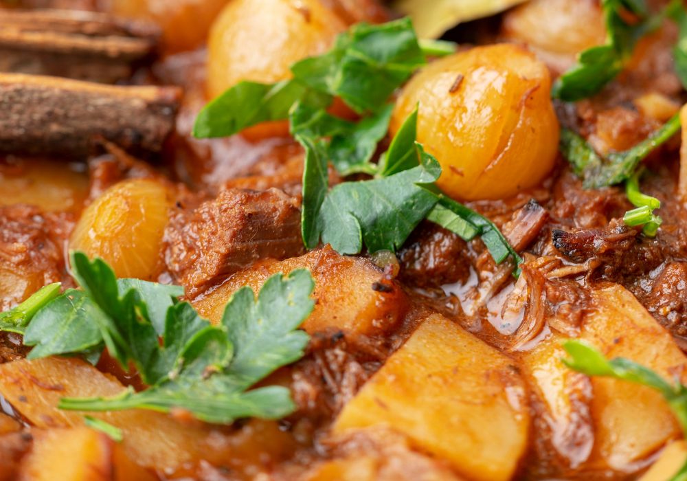 A close-up of Greek stifado with some parsley on top