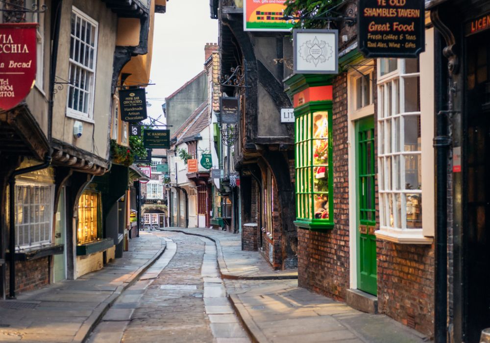 The Shambles in York, England, at early morning on the famously narrow medieval street in the historic center of York, filled with shops, pubs, and more!