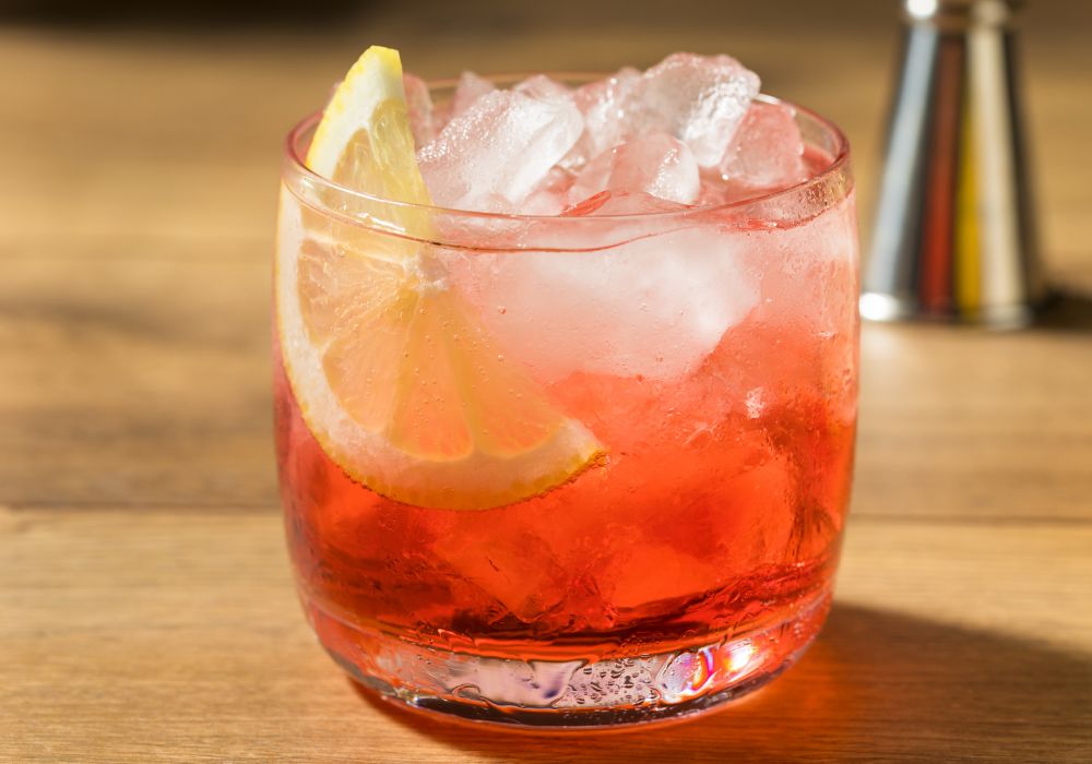 Boozy refreshing Campari spritz cocktail with a lemon garnish