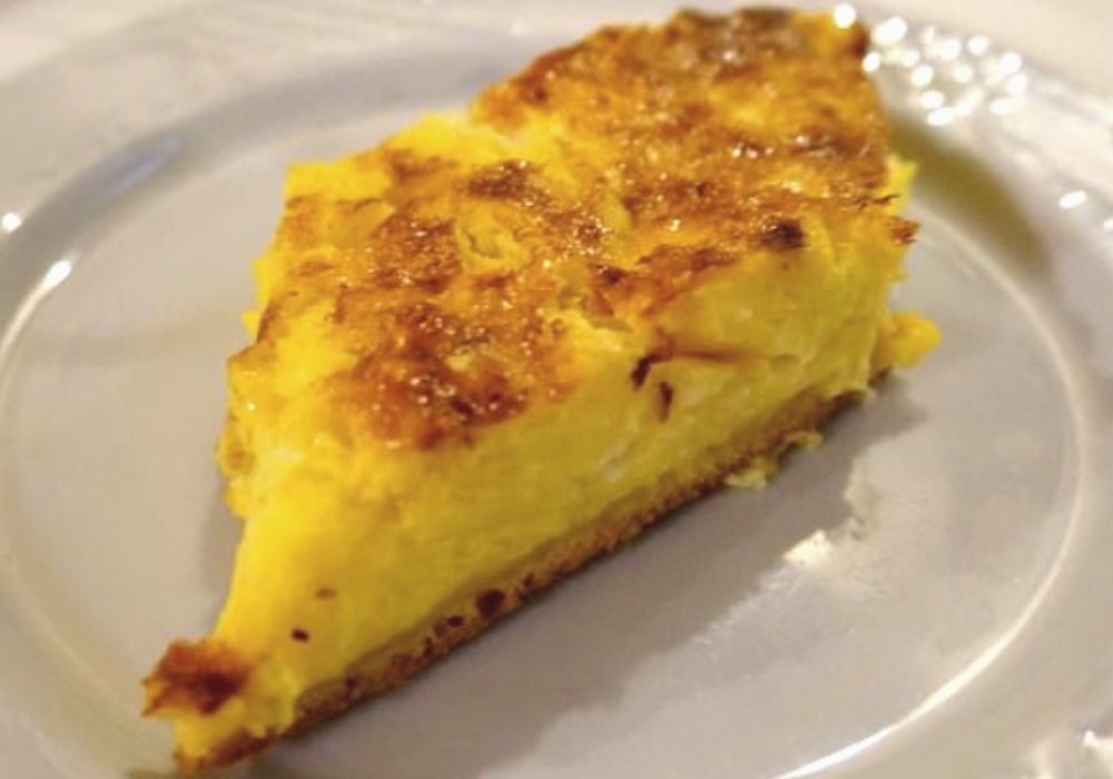 A delicious local byrek served on a white ceramic plate