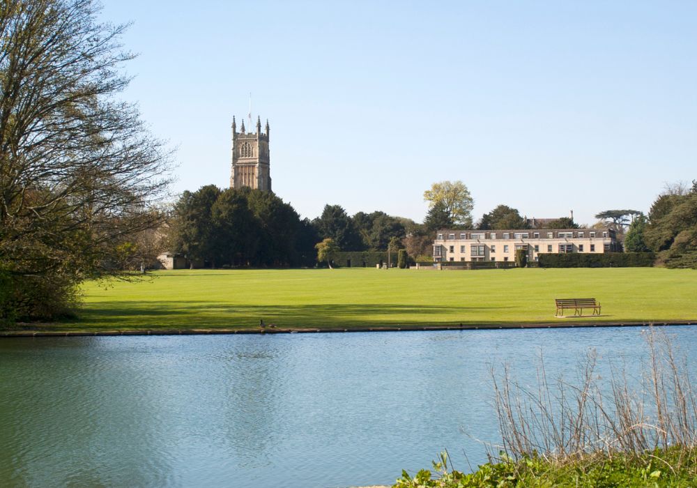 The Abbey Church and Cirencester Park in the Cotswolds, UK.