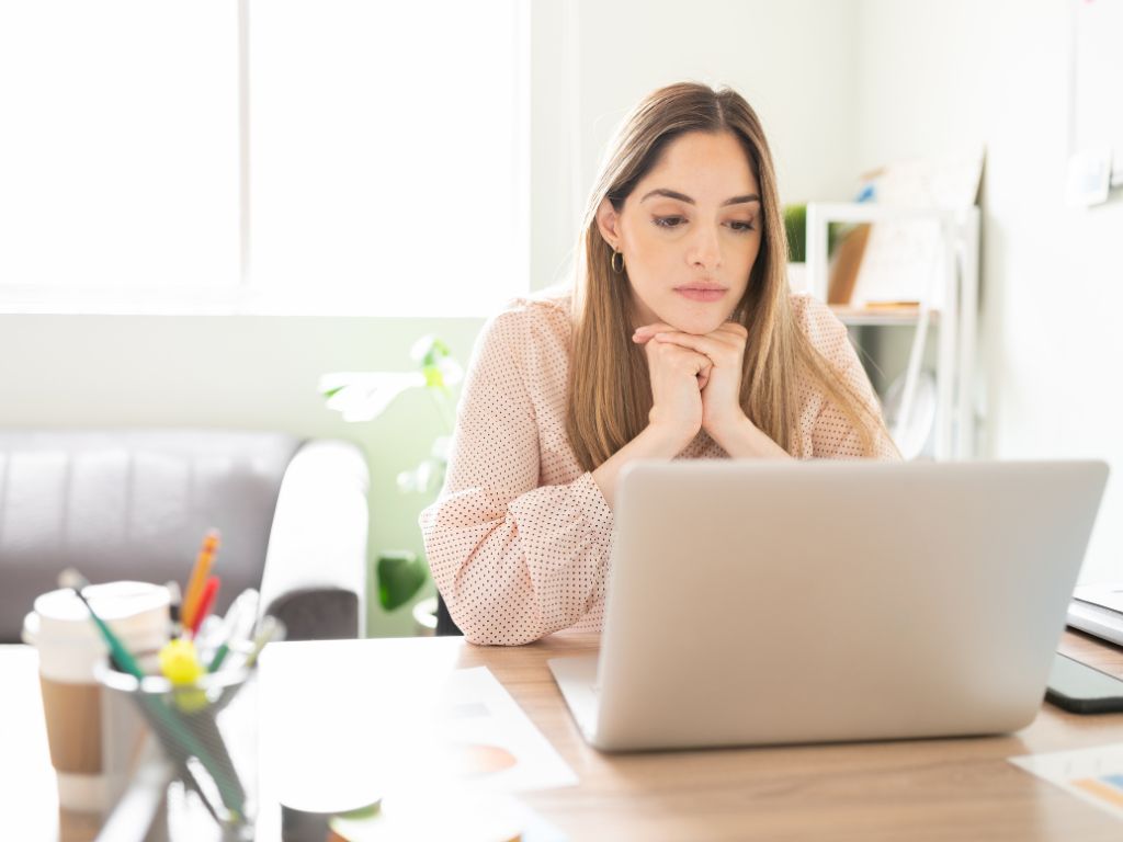 woman watching ads from her laptop to make money online